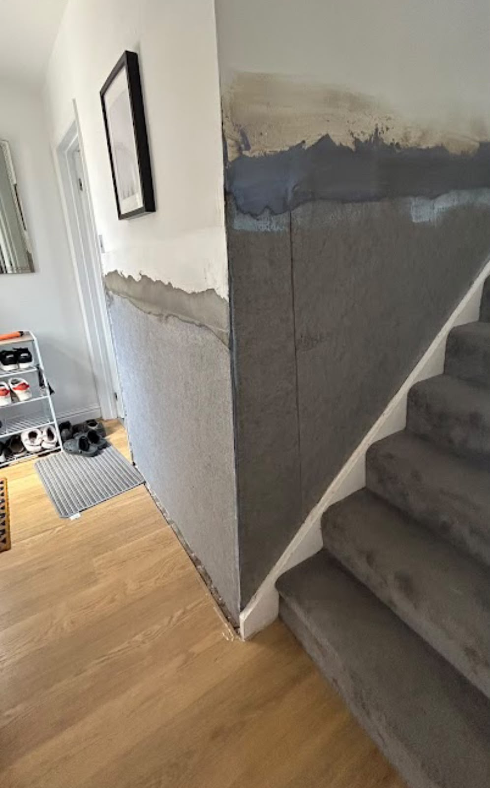 Staircase wall damp proofing in progress
