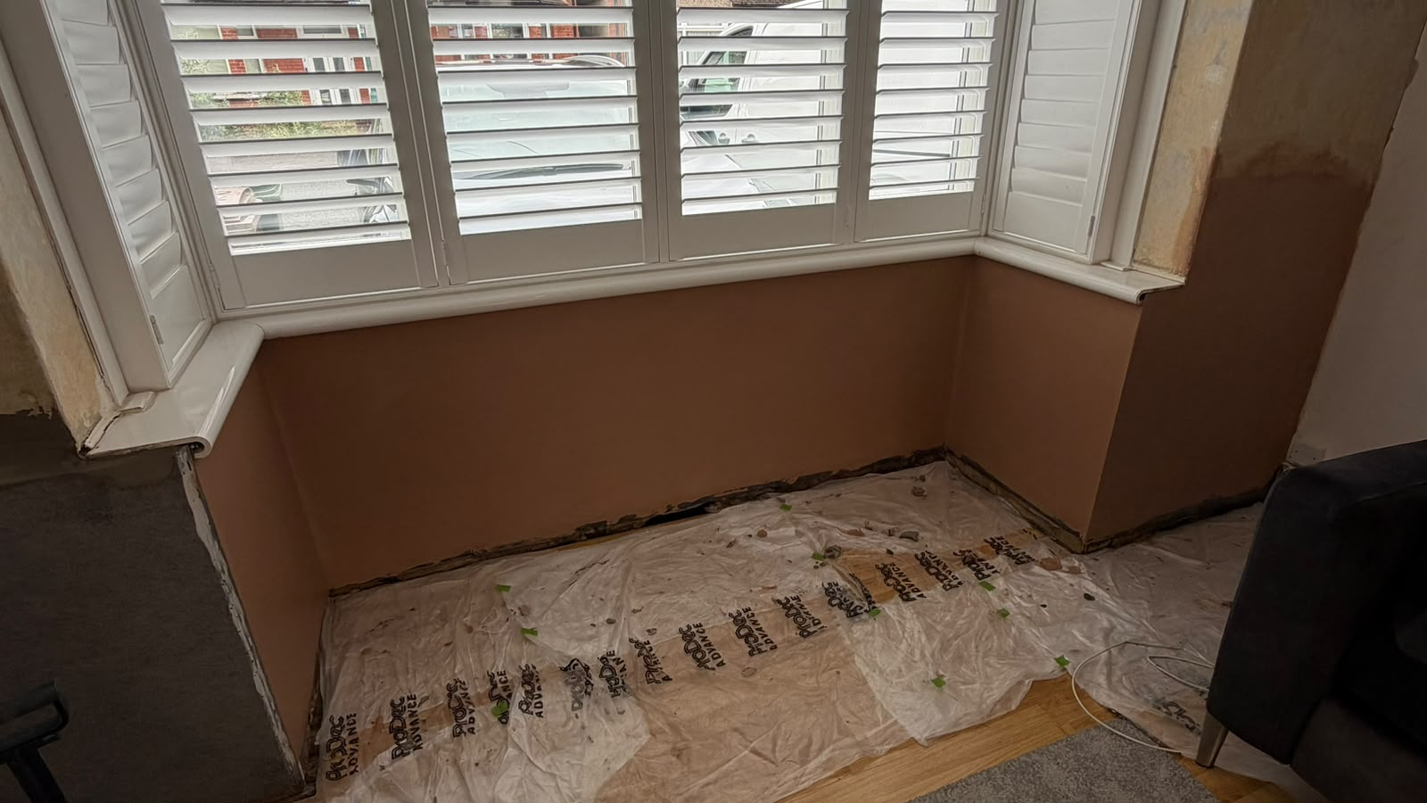 Bay window area plastering and damp work
