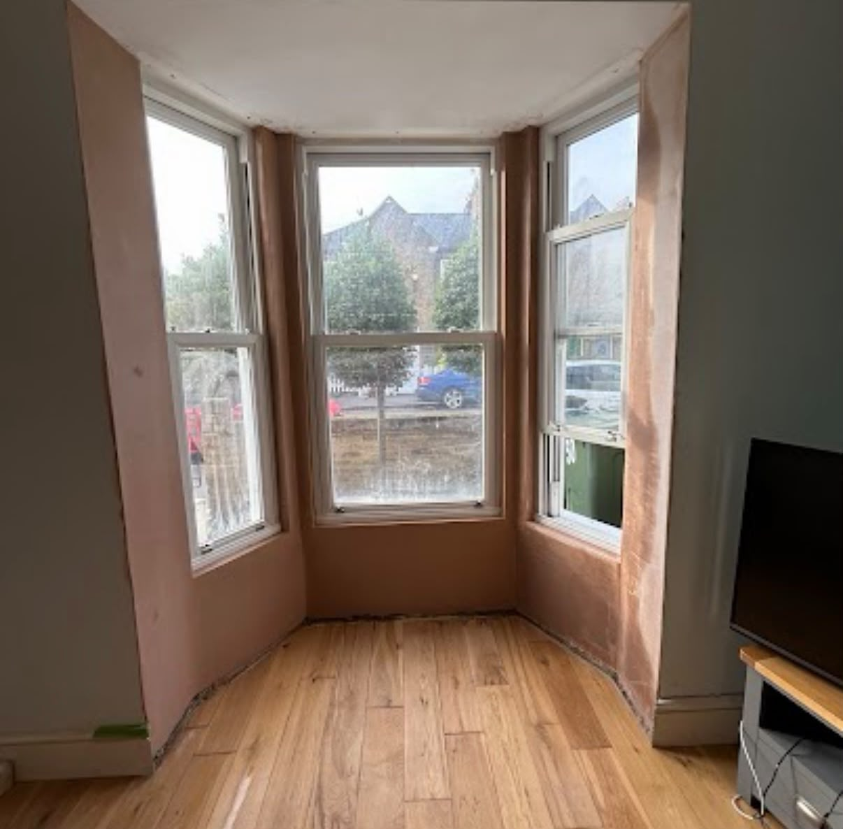 Bay window reveals re-plastered in living room