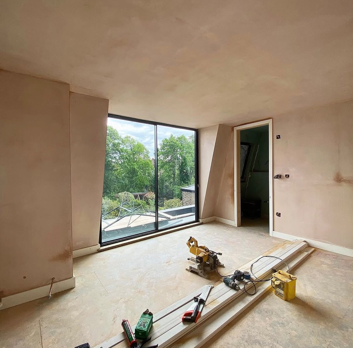 Large room freshly skimmed with floor-to-ceiling glazing