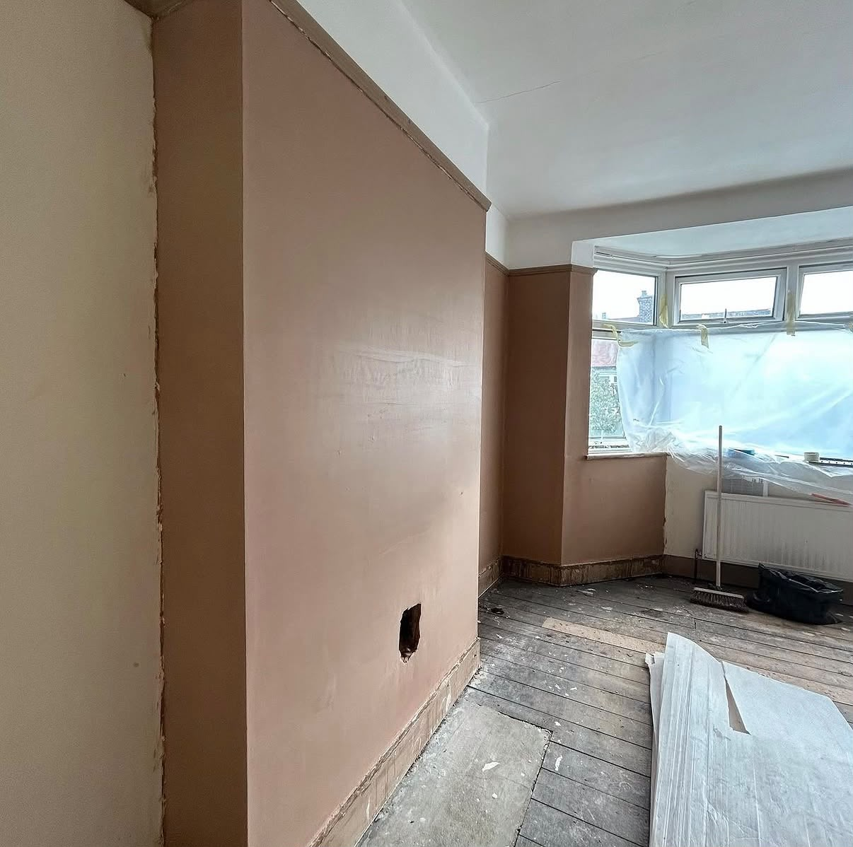 Lounge wall re-plastered and smooth - ready for decorating
